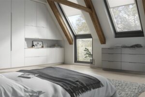 Built-in Nepture door white wardrobe with multiple cabinets and grey drawers, fitted into a sloped ceiling bedroom with exposed wooden beams.