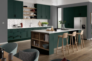 Modern kitchen with Serica doors in Heritage Green (dark green), featuring an island with breakfast bar