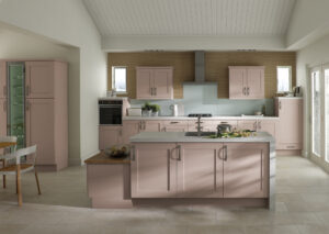 Modern kitchen with Carmen doors in Kashmir (light biege/pink), featuring an island and low table
