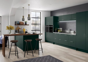 Modern kitchen with Serica doors in Heritage Green (dark green), featuring a breakfast bar