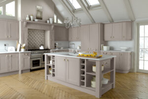 Modern kitchen with Serica doors in Taupe (light brown / grey), featuring an island with storage