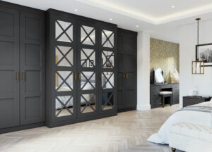 Contemporary bedroom with Hamptom Graphite (dark grey) wardrobe featuring crisscross mirrored doors against a herringbone wood floor
