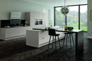 Modern kitchen with Lastra doors in Cashmere (light beige / grey), featuring an island and breakfast bar